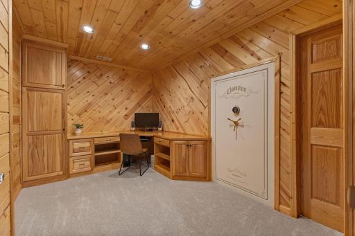 Den in lower level with custom built-ins and safe