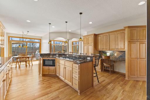 Large kitchen island with cooktop and microwave
