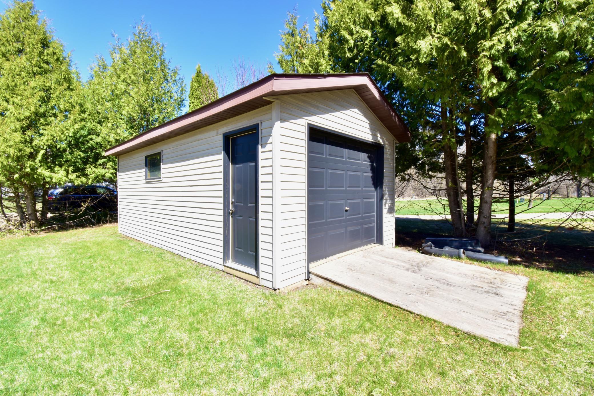 5123 Green Meadow Road SE Osakis, MN 56360 In addition to the 3-car garage is this storage shed, it includes a work bench and could be insulated for year-round use.