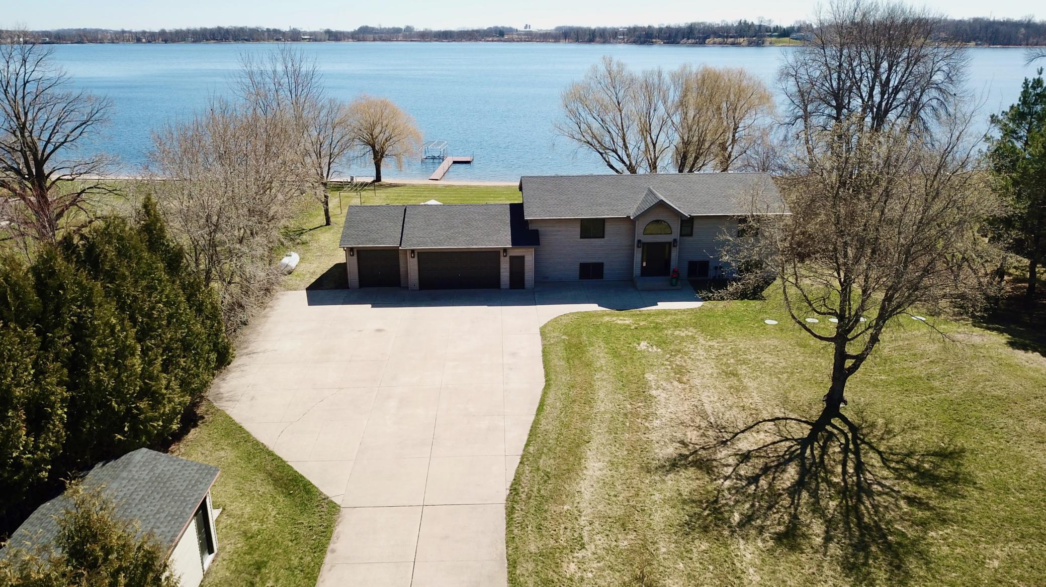 5123 Green Meadow Road SE Osakis, MN 56360 Beautiful yard the front is just as level as the lakeside. The concrete driveway is generous in size - allowing for multiple cars and or trailers.