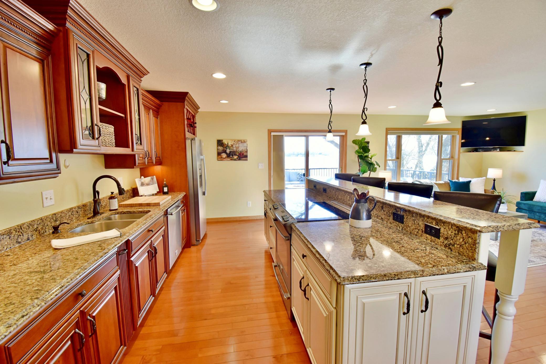 5123 Green Meadow Road SE Osakis, MN 56360 Oversized galley kitchen - cabinets include some pull outs and even a concealed charging station for phones and more.