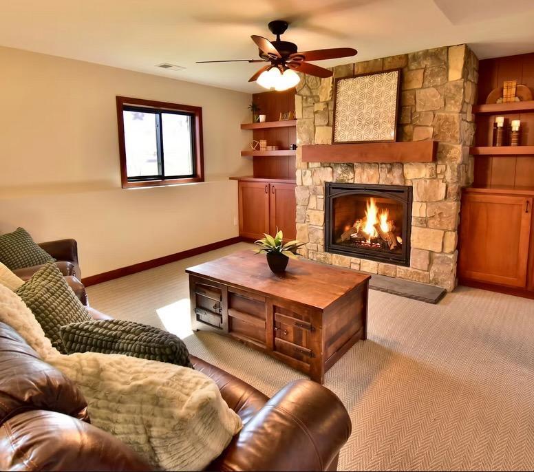 5123 Green Meadow Road SE Osakis, MN 56360 Built ins and the gas fireplace and stone surround elevate the feel here while still feeling comfy.