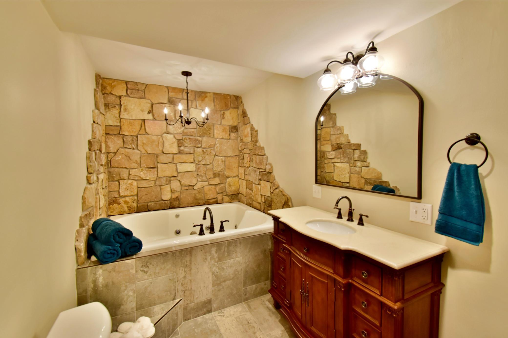 5123 Green Meadow Road SE Osakis, MN 56360 Exquisite bath whirlpool bath, custom cabinetry, tiled walk in shower. This is a retreat in its own!