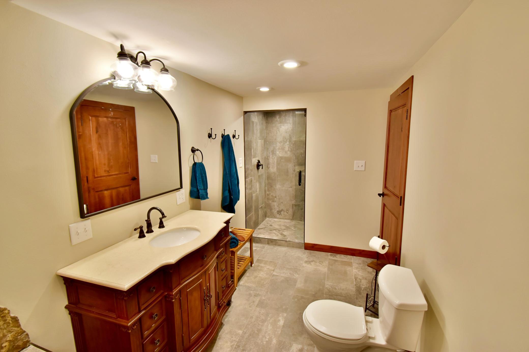 5123 Green Meadow Road SE Osakis, MN 56360 Exquisite bath whirlpool bath, custom cabinetry, tiled walk-in shower. This is a retreat in its own!