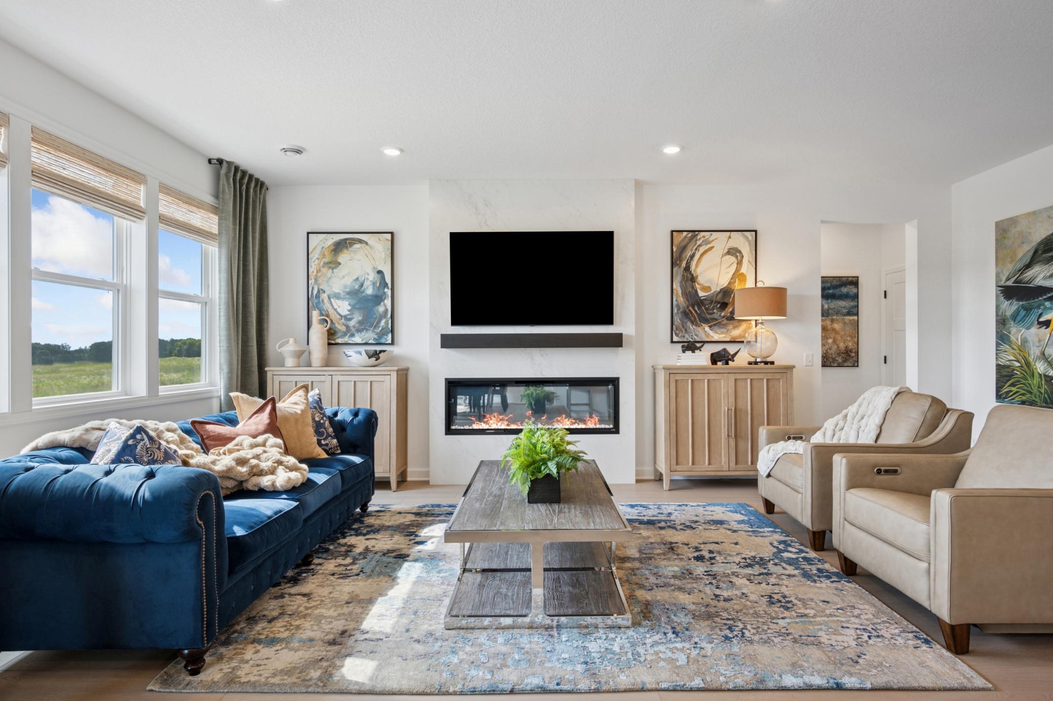 (Photo of a model home, actual finishes may vary) The Great Room features a warming electric fireplace.