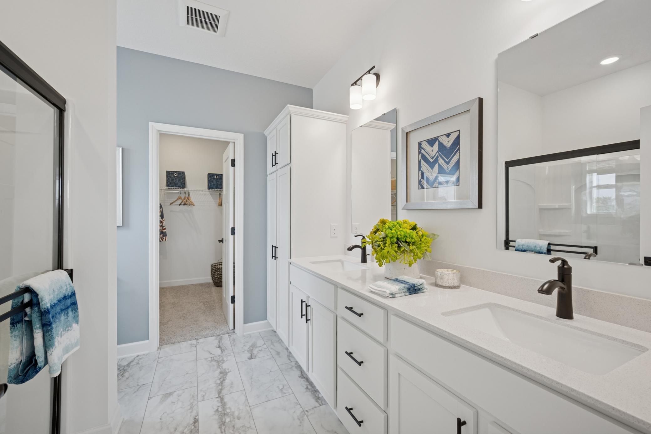 (Photo of a model home, actual finishes may vary) Adjacent to the owner's suite, this private bath is truly a retreat.