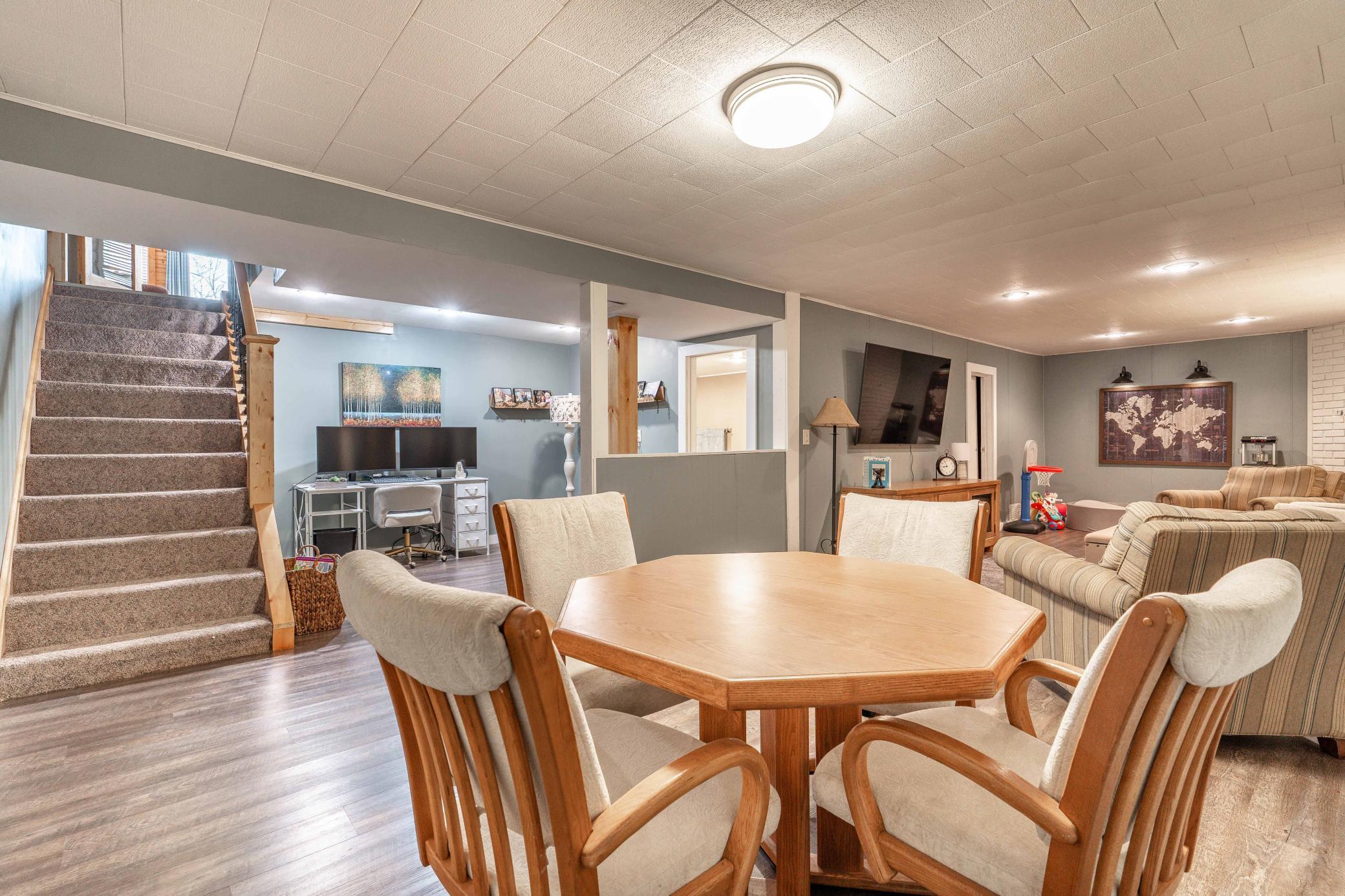 Lower Level Living Space with Office, Stairway in Background