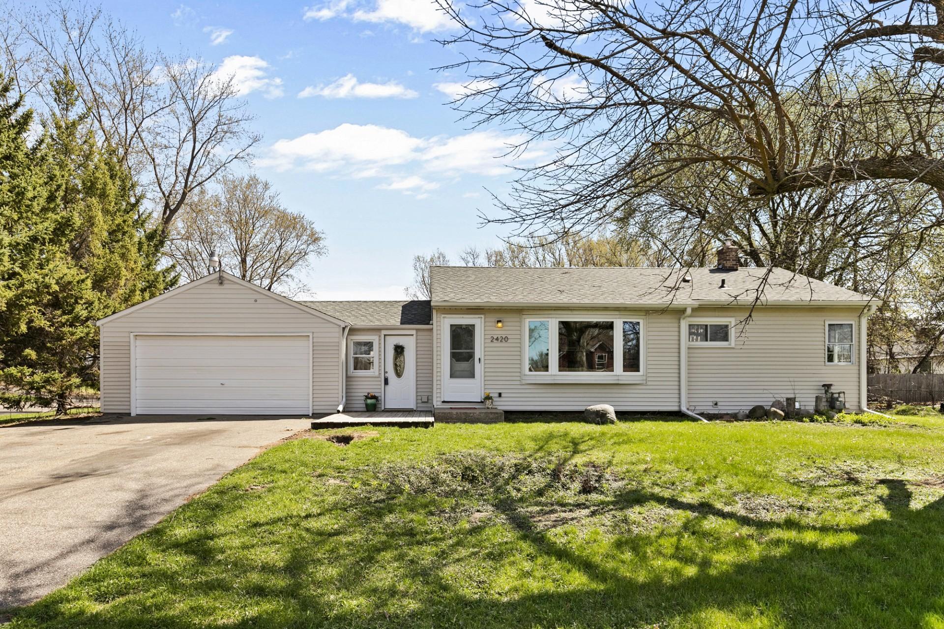 Welcome home! This charming Maplewood property offers fantastic curb appeal and a beautifully spacious front yard.