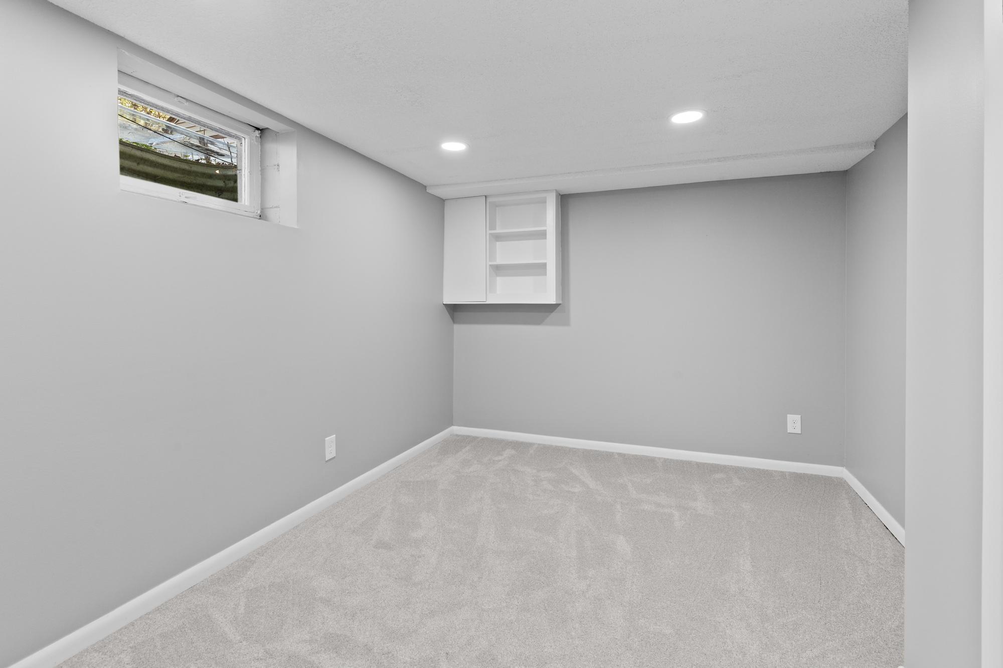 This fantastic lower level bonus room makes an ideal quiet home office, craft room, or dedicated hobby space.