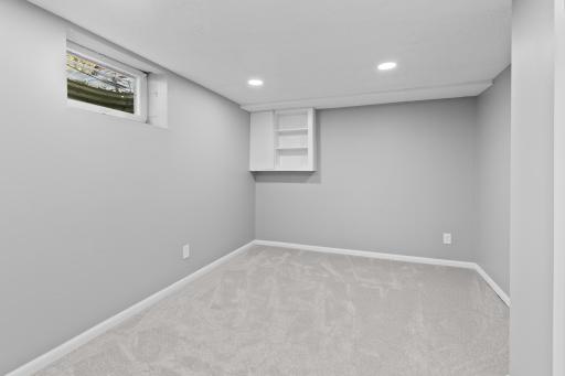 This fantastic lower level bonus room makes an ideal quiet home office, craft room, or dedicated hobby space.