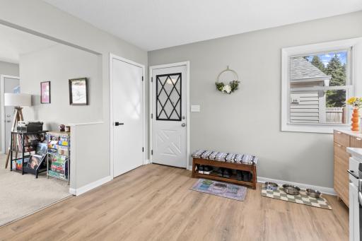 Stepping inside from the breezeway, you are greeted by an incredibly convenient entryway space, perfect for kicking off your shoes and dropping your keys.