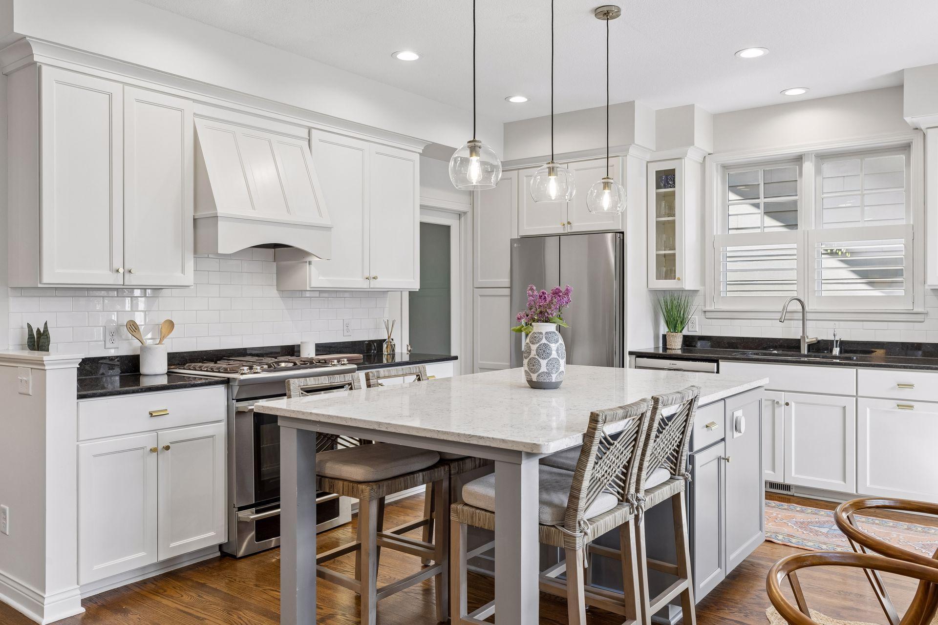 The kitchen was updated in 2021, including expanding the center island to add additional breakfast bar seating.