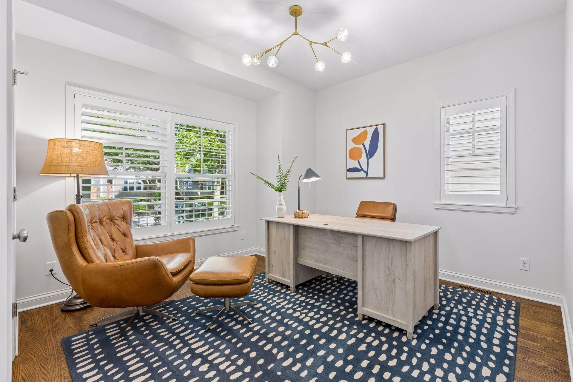 Main floor bedroom or office, with adjustable wooden shutters, both stylish and energy efficient.