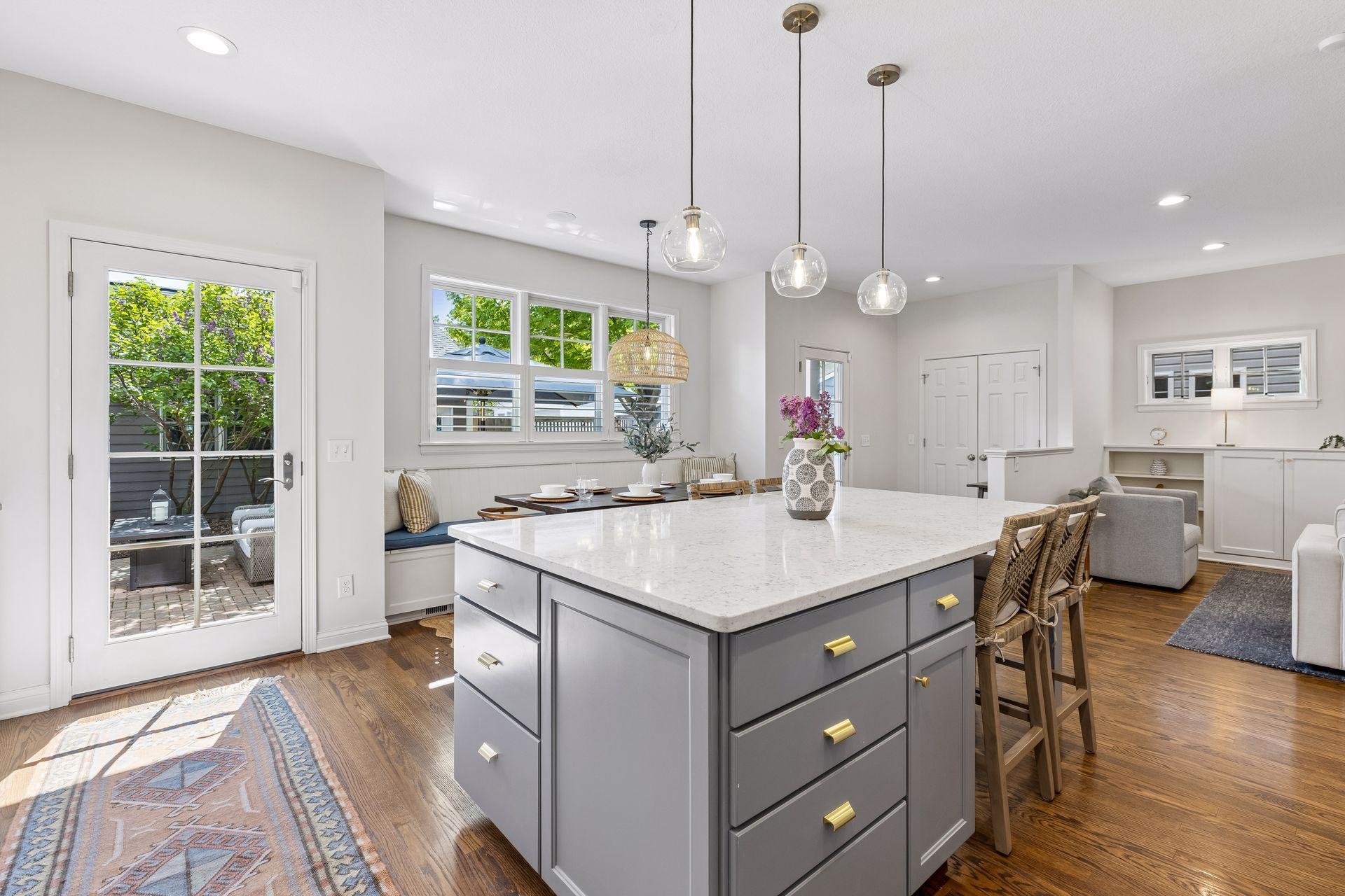 Dual French back doors access the backyard, both with sliding screen doors, expanding the living space outdoors in warmer months.