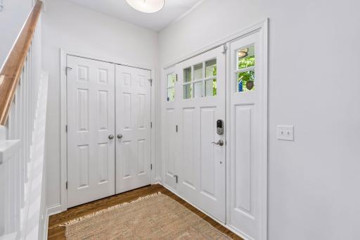 Inviting foyer, with custom California Closet system in the front closet.