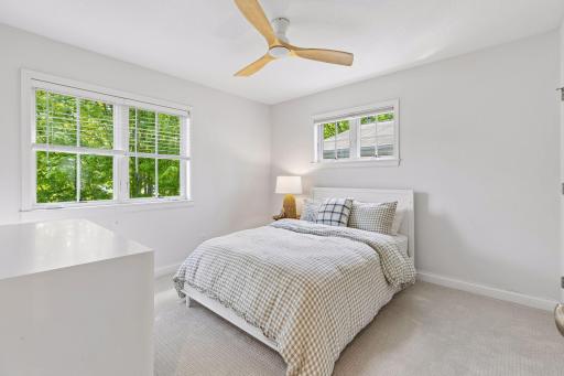 Third bedroom of three upstairs, with fresh paint, new carpet, and updated ceiling fan with LED light.