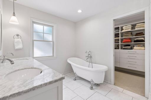 Frosted glass window allows for natural light with privacy.