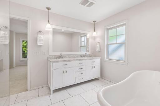 Luxurious heated flooring in the primary ensuite bath.