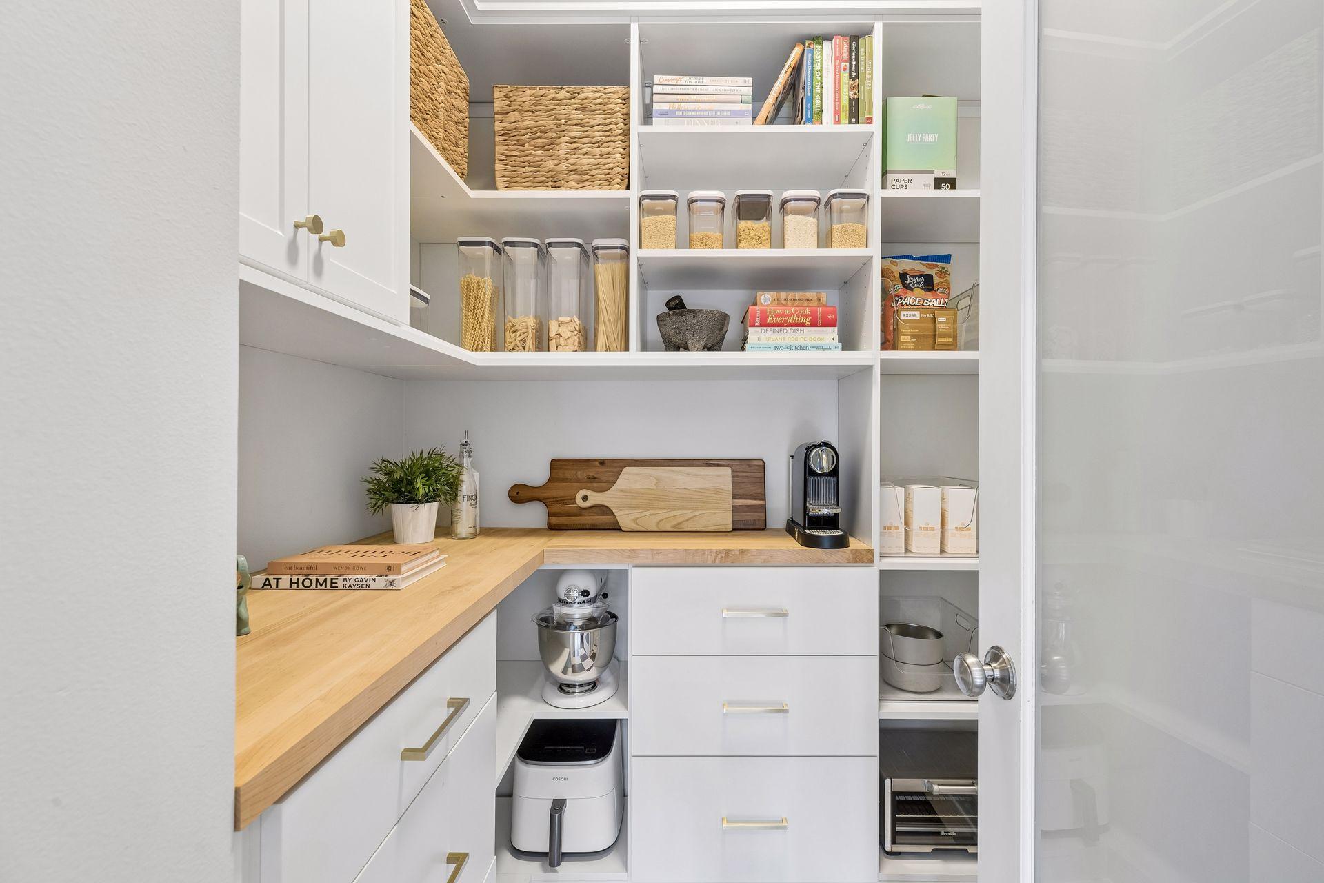 Gorgeous and functional custom California Closet designed kitchen pantry.