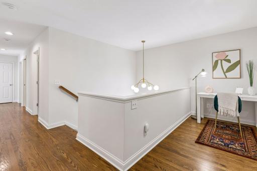 Loft area at the top of the stairs, with updated lighting, can be used as an office, play area or reading nook.