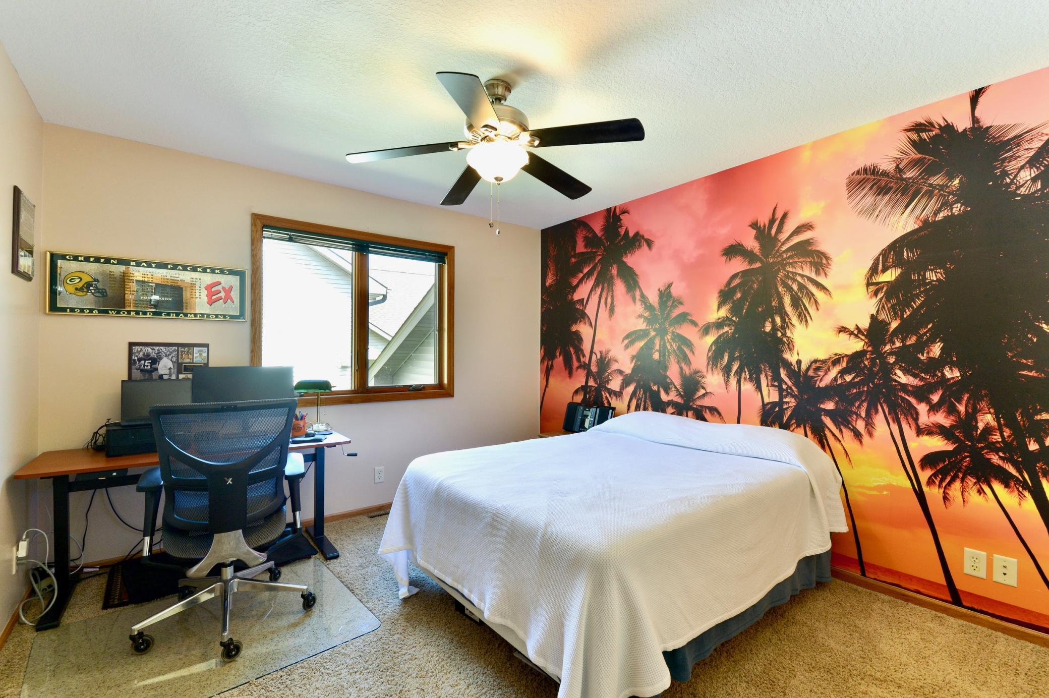 Bedroom 2 on the upper level has a walk in closet