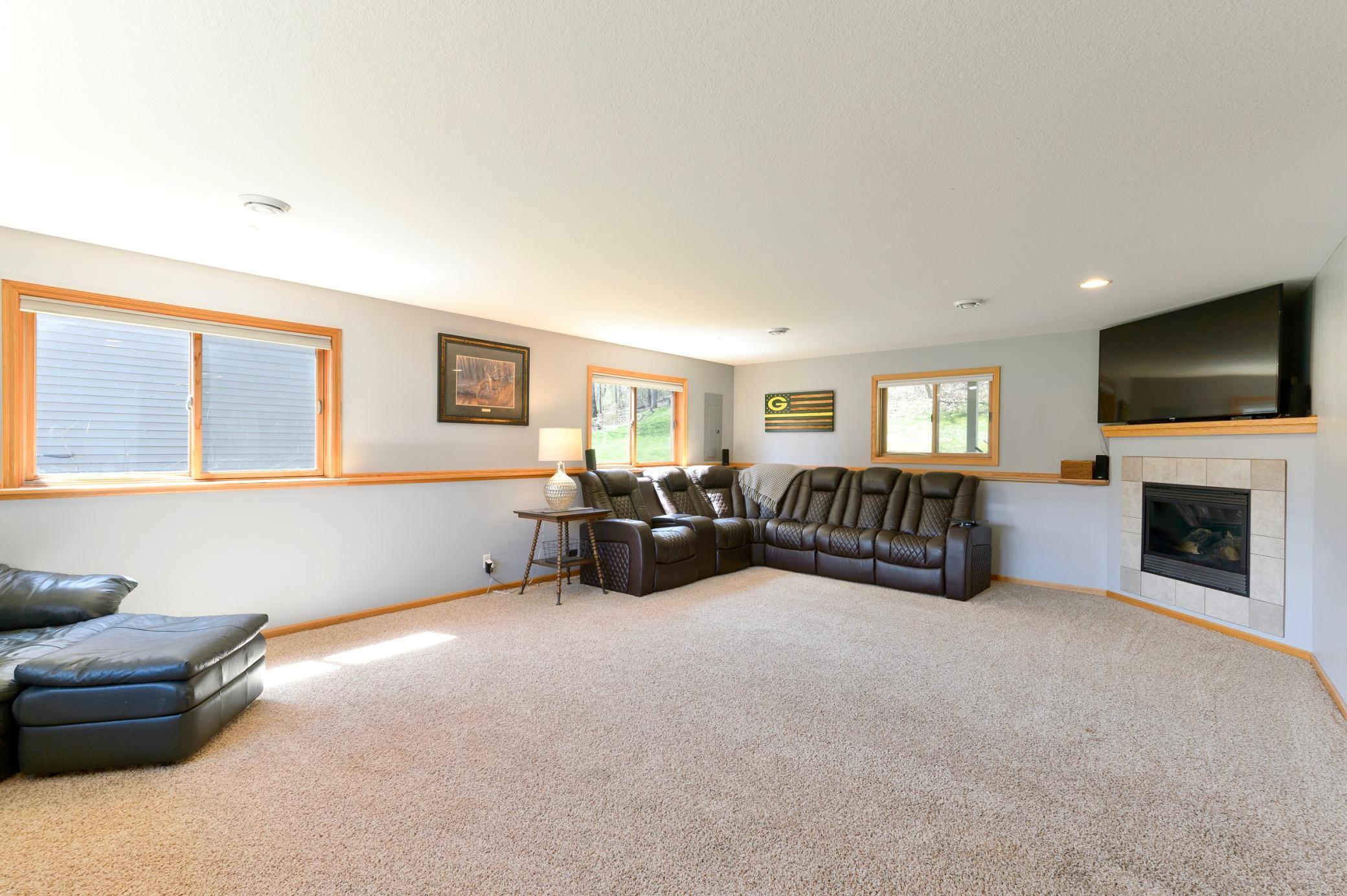 Huge lower level family room with fireplace