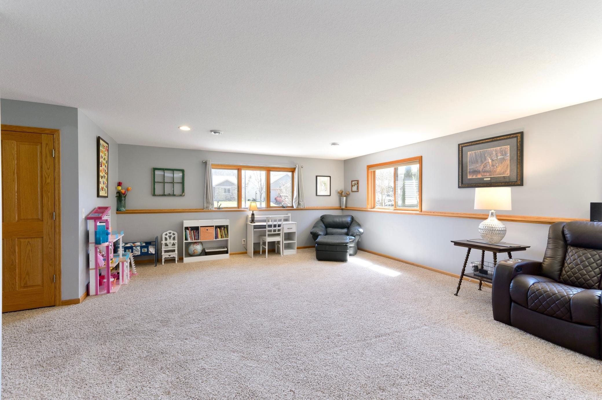 Another view of the family room includes many windows