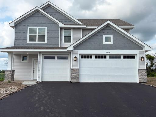 Welcome to 7676 Lotus Ln! (Photo is of the actual home.)