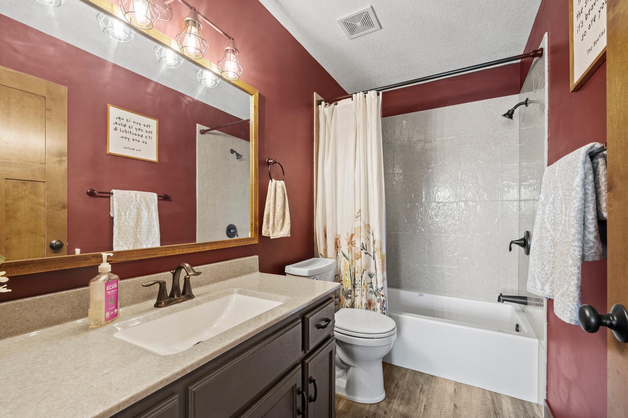 Upper level full bath with corian, grout free, stone slabs