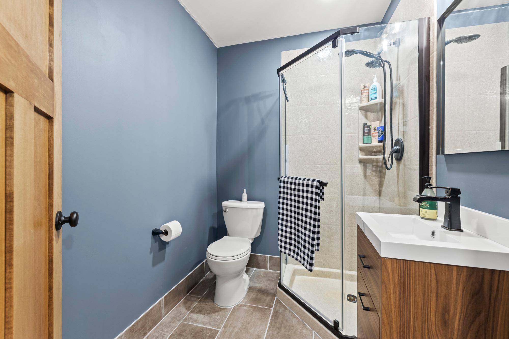 3/4 basement bath with corian, grout free, stone slabs