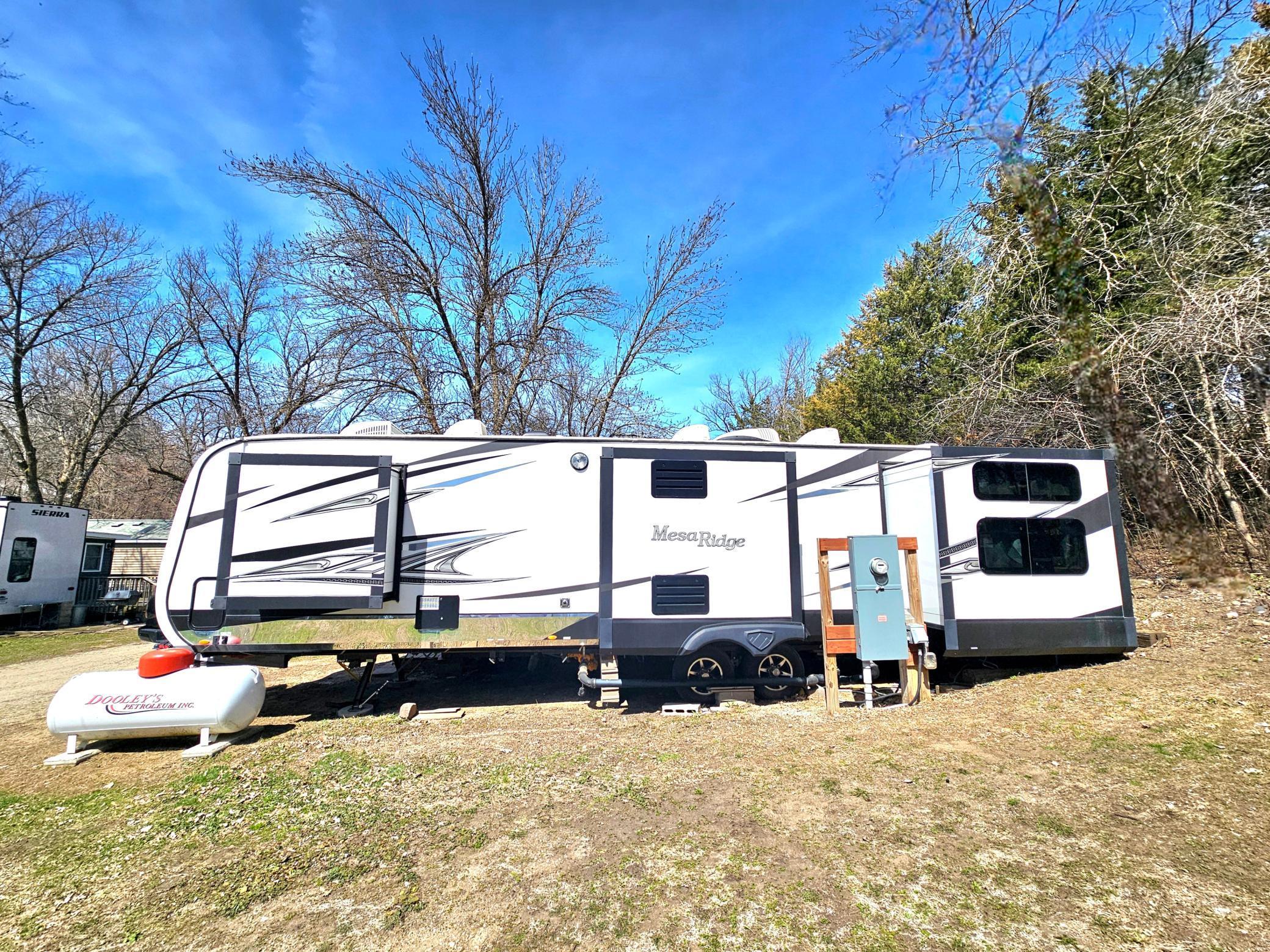 Back of camper. Lot adjoining common area which can be used for extra parking