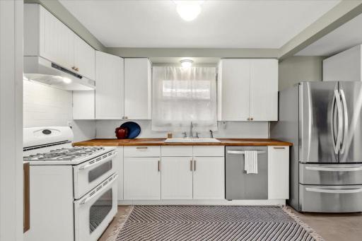 Large Kitchen with plenty of storage + new flooring.