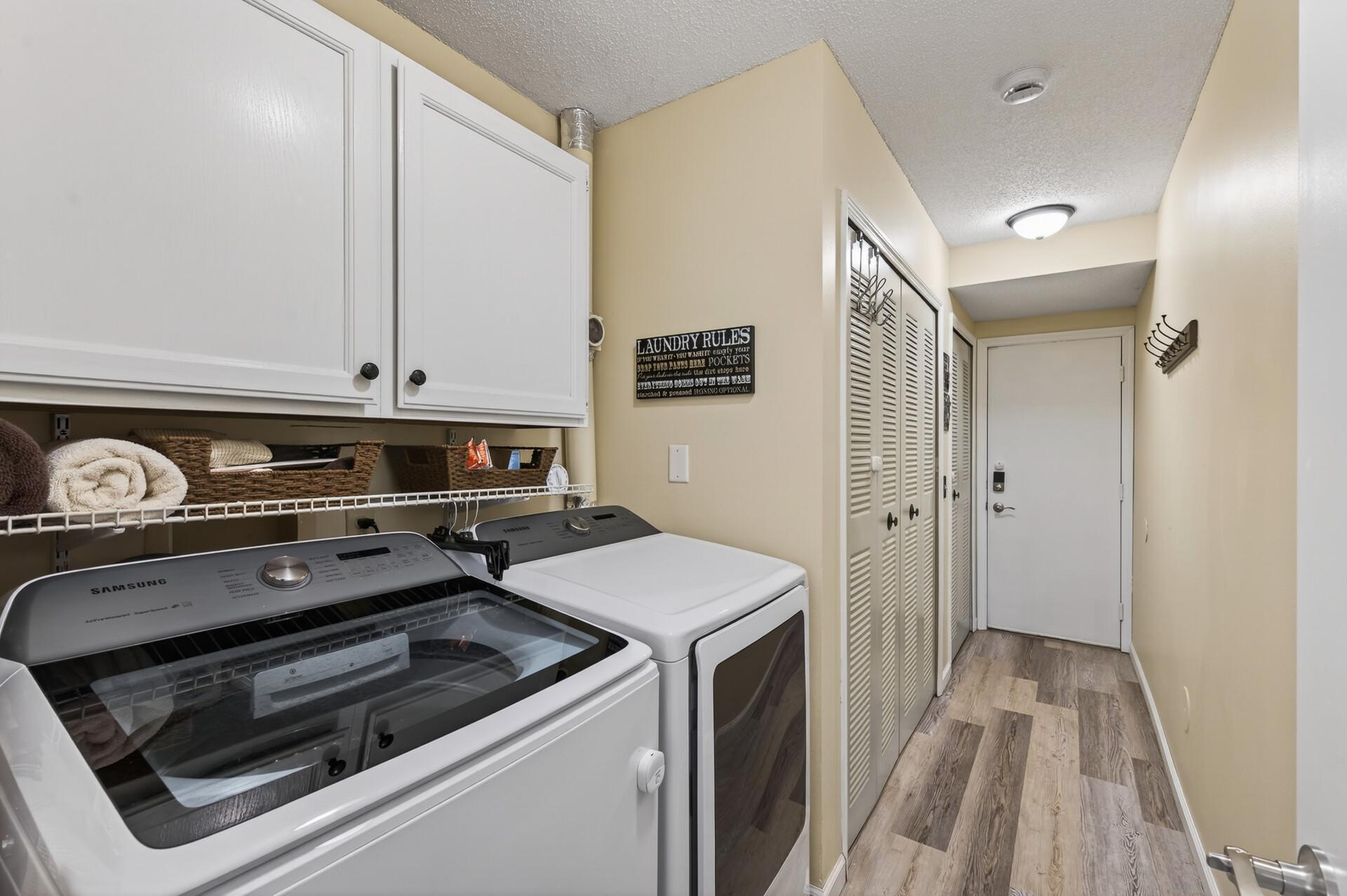 Laundry room/mechanical room leads to double car garage.