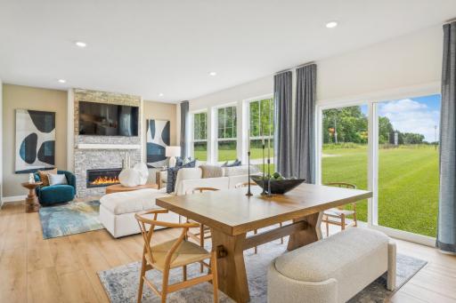 (Photo of model home, finishes will vary) Situated in front of glass sliders, this nook provides a perfect place for sun-dappled meals that can venture out to the backyard.
