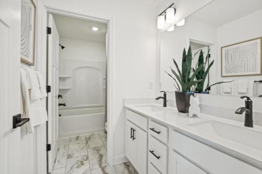 (Photo of model home, finishes will vary) The secondary bath.