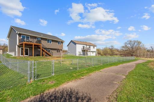 Walking path behind your fully fenced in backyard