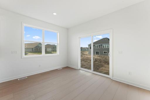 A sliding glass door offers simple outdoor access for al fresco dining options and much more
