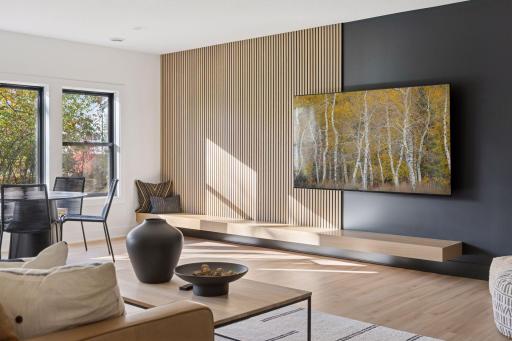 Acoustic vertical wood wall with rift white oak hearth ~ Lower Level