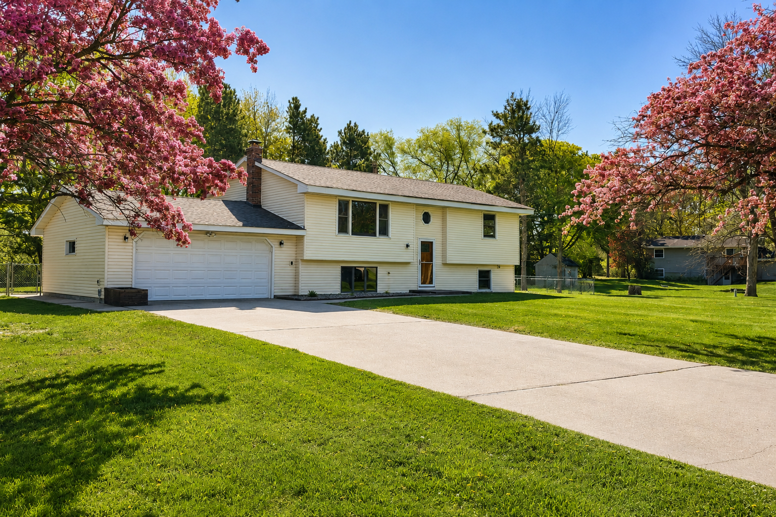 Welcome home to nearly an acre with mature trees, fenced backyard space, and an oversized attached garage.