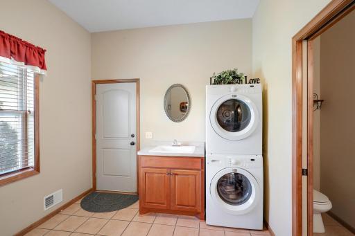 The laundry room has a window for great natural light and a convenient 1/2 bath.