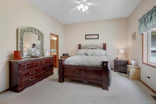 Primary bedroom also offers 10 foot ceilings and walk-through bath.