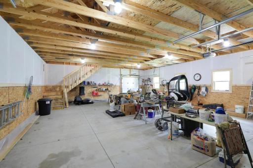 The detached garage measures 36 deep x 28 wide with a stairway to a loft above.