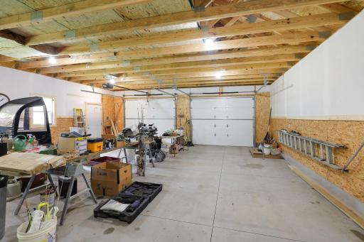 Front garage doors measure 10' wide x 8' high one with opener and other with outlet ready.
