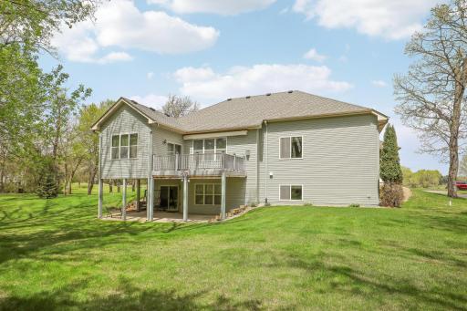 Rear view of the home, deck and covered patio.