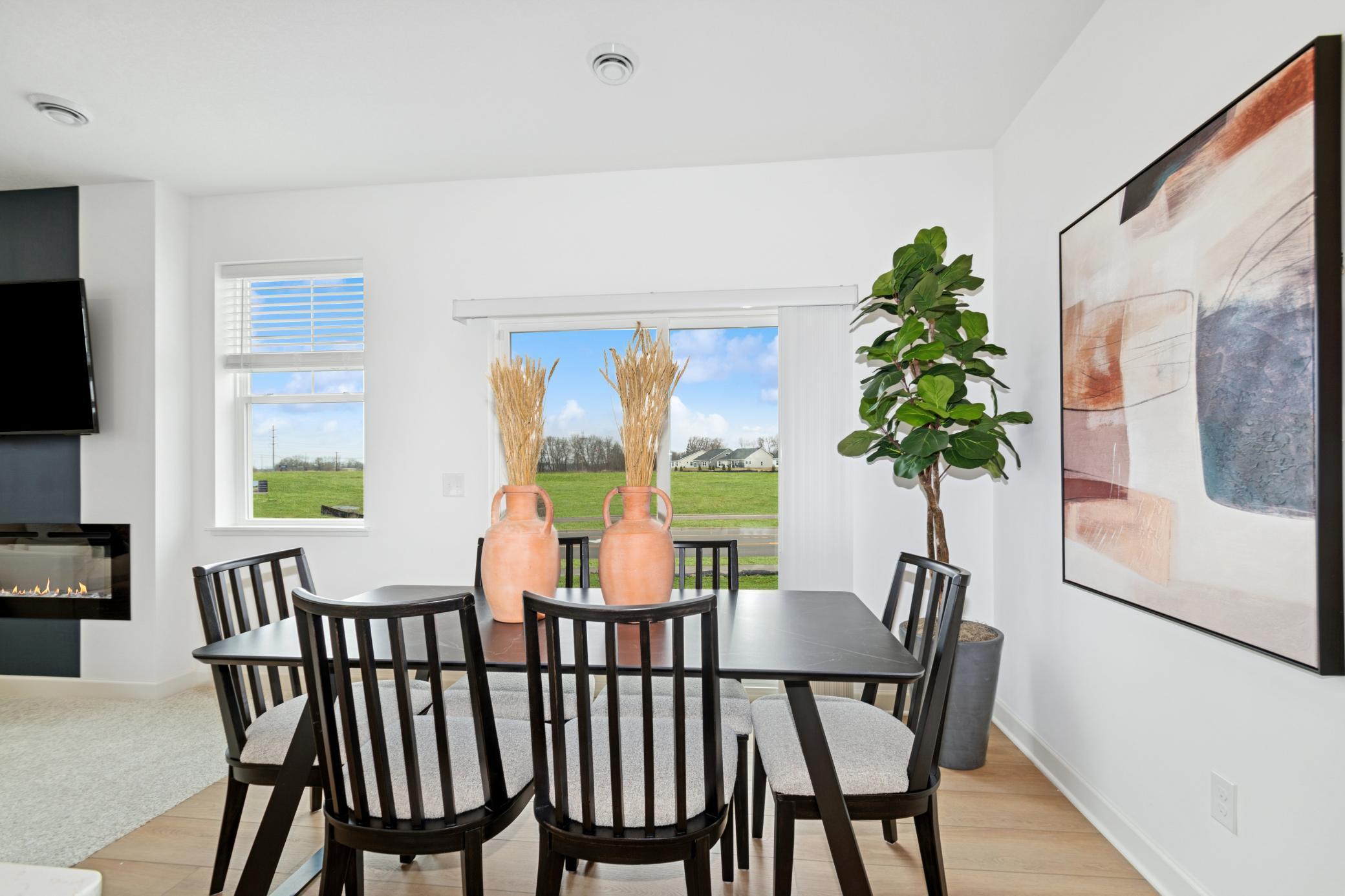 (Photo of model home, features will vary). Sharing a convenient layout with the kitchen, the dining room makes it a breeze to serve piping-hot meals straight off the stove and host delicious meals of all sizes on the dinner table.
