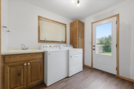 7'x9' mudroom/laundry room with new convenient access to the rear yard. Washer & dryer to remain with home.