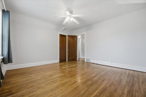 Bedroom 2 measures 9'x14' & also features original hardwood floors, ceiling fan, & updated windows.