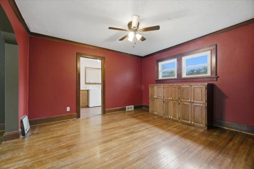 Laundry room plus 3/4 bath located off the dining room. Cabinets to stay with property.