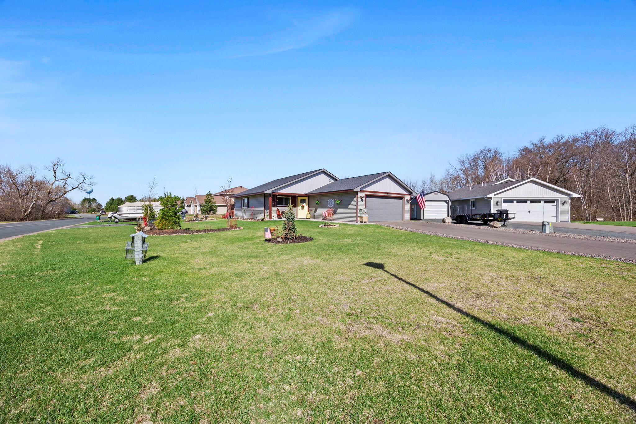 Large corner lot with professional landscaping and large yard space