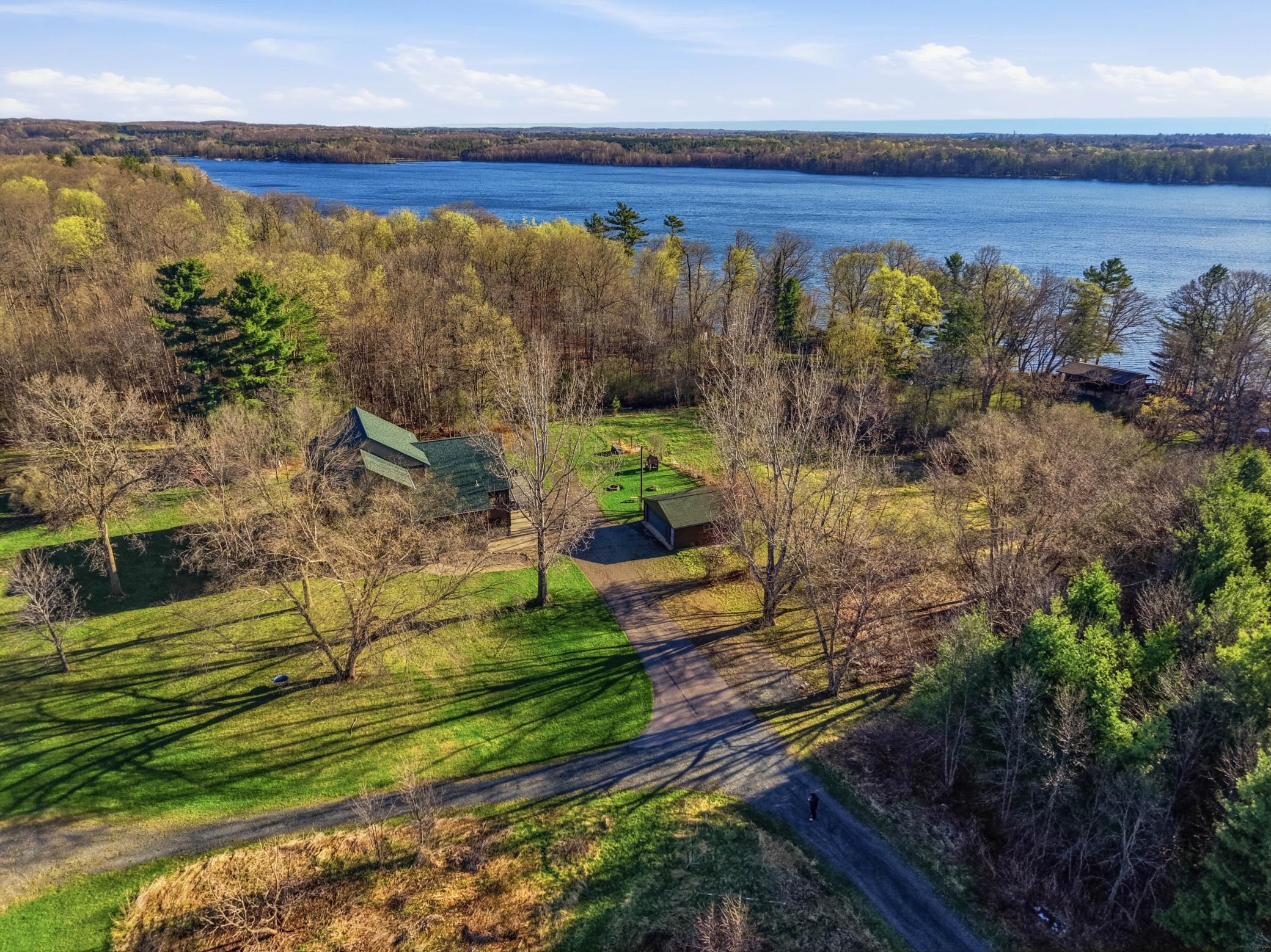 This one of a kind property offers acreage, multiple out buildings, and lakeshore!